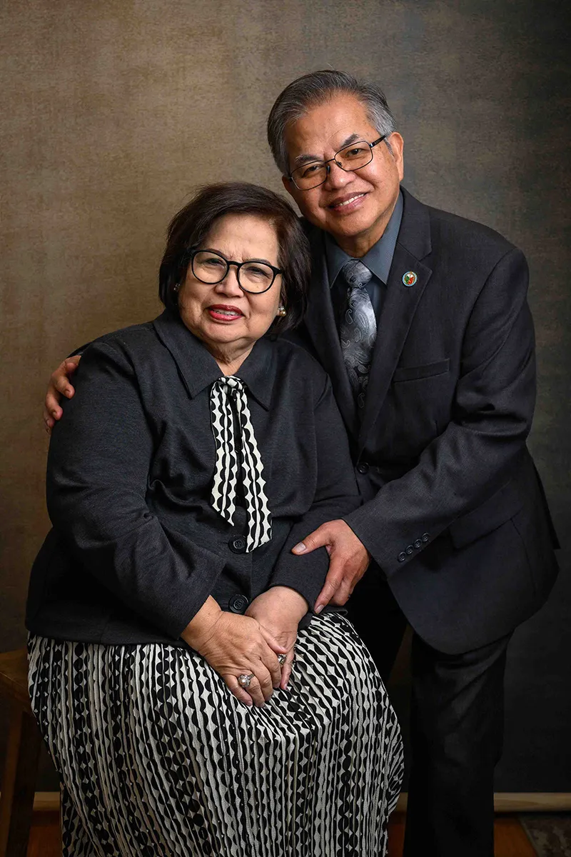 Older couple embracing together for a studio portrait